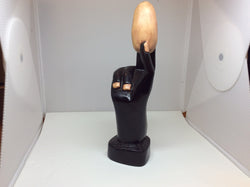 Hand Holding an Egg Carving